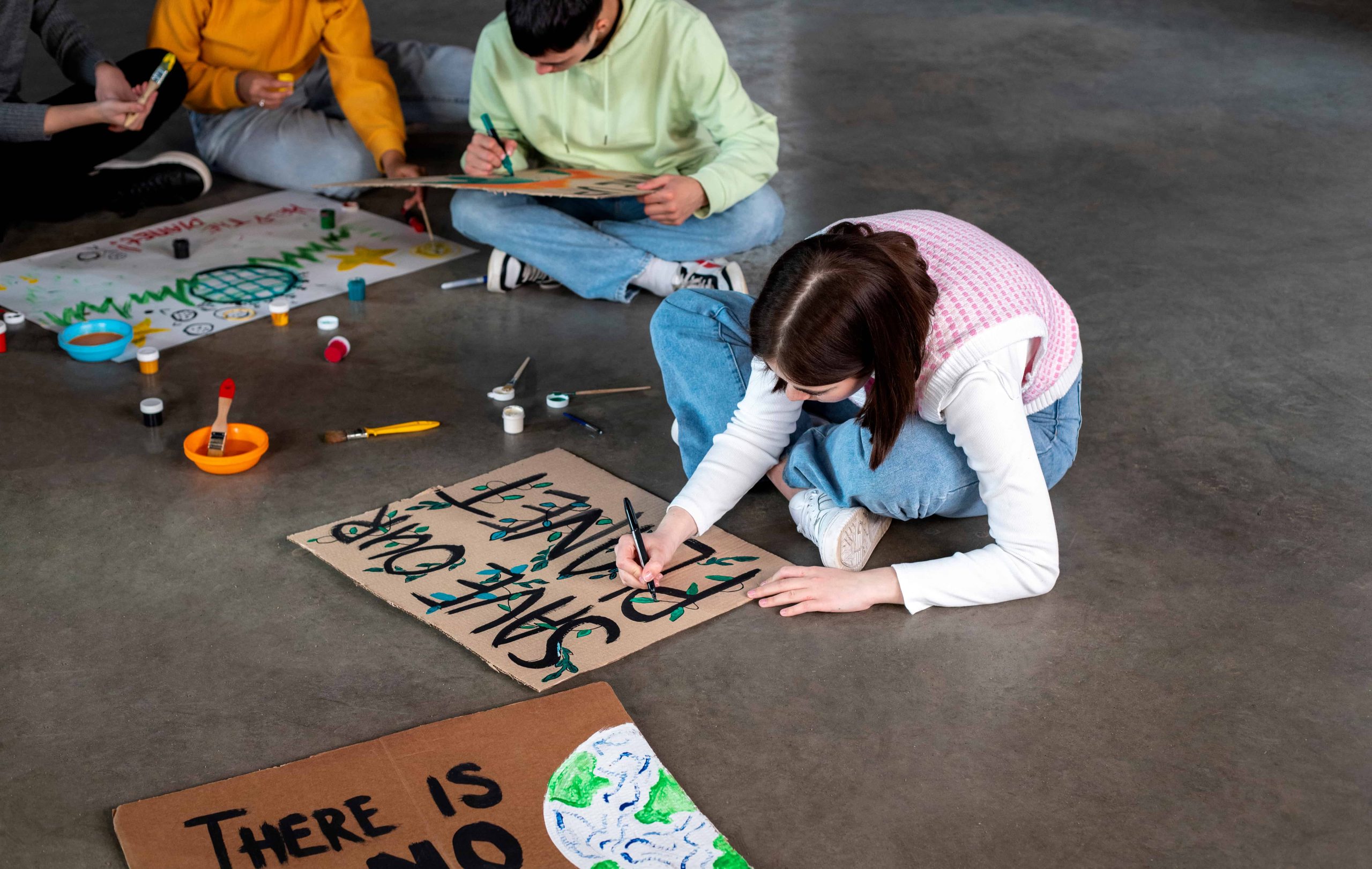 high-angle-young-people-sitting-together (1)